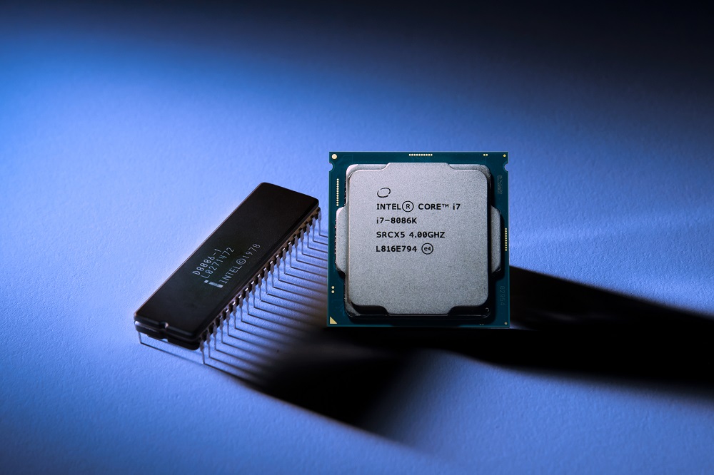 A photo of the original Intel 8086 processor from 1978 next to the new Intel Core i7-8086K limited edition processor. (Credit: Intel Corporation)