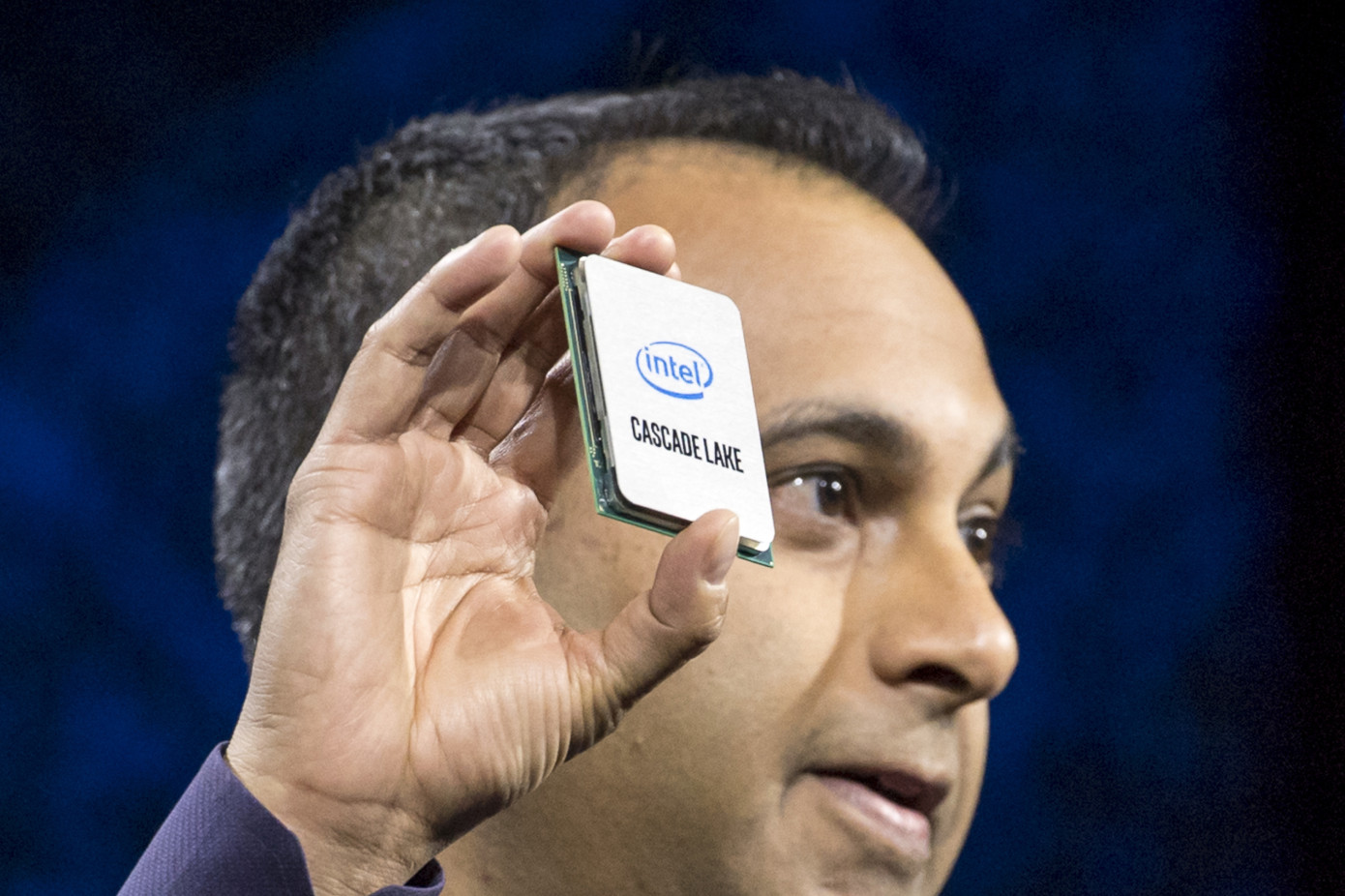 Navin Shenoy, executive vice president and general manager of the Data Center Group at Intel Corp., holds up the Cascade Lake processor during the company's event at the 2019 Consumer Electronics Show (CES) in Las Vegas, Nevada, U.S., on Monday, Jan. 7, 2019. Dozens of companies will give presentations at the event, where attendance is expected to top 180,000, with the trade war between the U.S. and China as well as Apple's sales woes looming over the gathering.  Photographer: David Paul Morris/Bloomberg